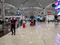 Check-in hall at Istanbul International Airport. Travelers with luggage in front of the Royalty Free Stock Photo