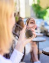 Check if everything is right. Beauty treatment and skin care concept. Reflexion girl looking in mirror check her Royalty Free Stock Photo