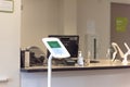 Check-in kiosk tablet at front desk of diagnostic testing