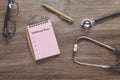 Check list for health text on book note with stethoscope on wood Royalty Free Stock Photo