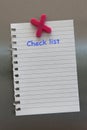 Check list note on a fridge door with magnet