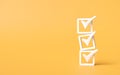 check mark icon stacked on yellow background. checklist survey concept