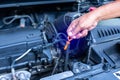 Check the oil level in car engine. Mechanic checking car engine or vehicle. Check and maintenance car with yourself Royalty Free Stock Photo