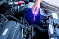 Check the oil level in car engine. Mechanic checking car engine or vehicle. Check and maintenance car with yourself Royalty Free Stock Photo