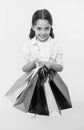 Check out her shopping packages. Child cute shopaholic with bunch shopping bags black friday total sale. Take shopping Royalty Free Stock Photo