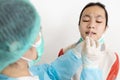 Check point for Coronavirus,Examining nasal mucus test from child girl,taking a swab inserted into the nostril,health check,