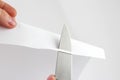 Check the sharpening of knife blades on paper Royalty Free Stock Photo