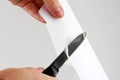 Check the sharpening of knife blades on paper Royalty Free Stock Photo