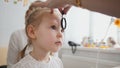 Check up of eyesight in child`s ophthalmology - optometrist diagnosis little girl