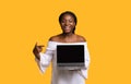 Check This Website. Cheerful Black Lady Pointing At Laptop With Black Screen Royalty Free Stock Photo