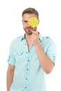 Check your vision. Man holds big lollipop in front of eye. Guy concentrated face passing vision test isolated white. Man