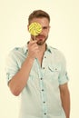 Check your vision. Man holds big lollipop in front of eye. Guy concentrated face passing vision test isolated white. Man