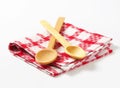 Checked tea towel and wooden spoons Royalty Free Stock Photo
