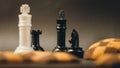 Checker board cookies with chess pieces blurred foreground and background