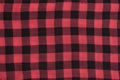 Checkered black and red textured fabric. Seamless. Close-up