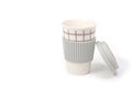 Checkered ceramic cup with rubber lid, shot against a white background