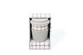 Checkered ceramic cup with rubber lid, shot against a white background