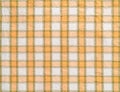 Checkered cotton fabric background. Macro texture of white orange kitchen towel. Detail of cloth texture surface. Colorful woven Royalty Free Stock Photo