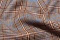 The checkered pattern on the fabric is made of different colors. Material for clothing Royalty Free Stock Photo