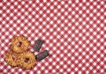 Red white checkered fabric with cookies and sweets Royalty Free Stock Photo