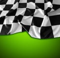 Checkered flag on green Royalty Free Stock Photo