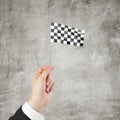 Checkered flag in hand Royalty Free Stock Photo