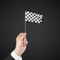 Checkered flag in hand Royalty Free Stock Photo