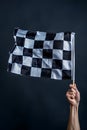 Checkered flag in hand. Racing, the concept of start, finish isolated Royalty Free Stock Photo