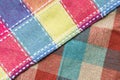 Checkered multicolored fabric background. The texture of a checkered multi-colored kitchen towel  space for text. Royalty Free Stock Photo