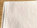Checkered notebook with spiral. An open notepad for notes. Soft focus. Copy space. Blank blank page for your text Royalty Free Stock Photo