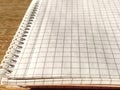 Checkered notebook with spiral. An open notepad for notes. Soft focus. Copy space. Blank blank page for your text Royalty Free Stock Photo