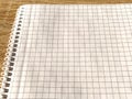 Checkered notebook with spiral. An open notepad for notes. Soft focus. Copy space. Blank blank page for your text Royalty Free Stock Photo