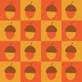 Checkered orange and mustard acorns seamless pattern