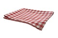 Checkered picnic folded kitchen cloth, food decor. Red checked tablecloth. Isolated towel Royalty Free Stock Photo