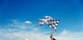 Checkered race flag in hand Royalty Free Stock Photo