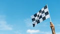 Checkered race flag in hand Royalty Free Stock Photo