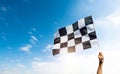 Checkered race flag in hand Royalty Free Stock Photo