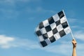 Checkered race flag in hand Royalty Free Stock Photo