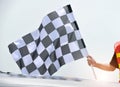 Checkered race flag in hand Royalty Free Stock Photo