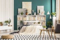 Checkered rug in stylish bedroom Royalty Free Stock Photo