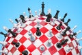 Checkered sphere, chess board with chess pieces. 3D rendering Royalty Free Stock Photo