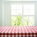 Checkered tablecloth texture top view on blur window view garden