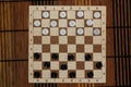 Checkers in checkerboard ready for playing. Game concept. Board game. Hobby. checkers on the playing field for a game. Royalty Free Stock Photo