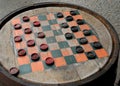 Checkers on a Wood Barrel