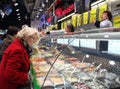 Checking behind the glass on a Belgian market