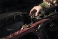 Checking the coolant level in the car. The cap of the radiator, check fluid, replacement fluid. Royalty Free Stock Photo