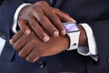 Checking his mail on the go just got easier. Cropped view of a young businessman wearing a smartwatch - All screen Royalty Free Stock Photo