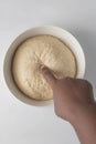 Checking if dough is proofed using a finger Royalty Free Stock Photo