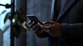 Checking notifications indoor setting smartphone user urban environment close-up view modern lifestyle