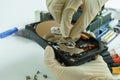 Checking Opened Hard Disk Drive in hand Royalty Free Stock Photo